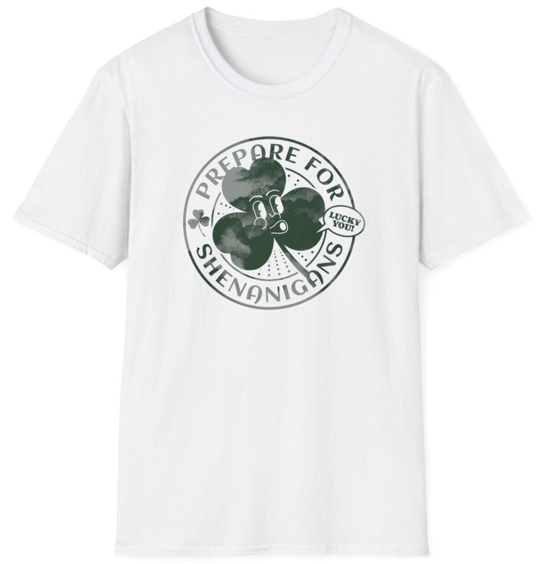 A white t shirt that reads Shenanigans over the top of a green shamrock. These original graphic tees are made of soft materials and 100% cotton.